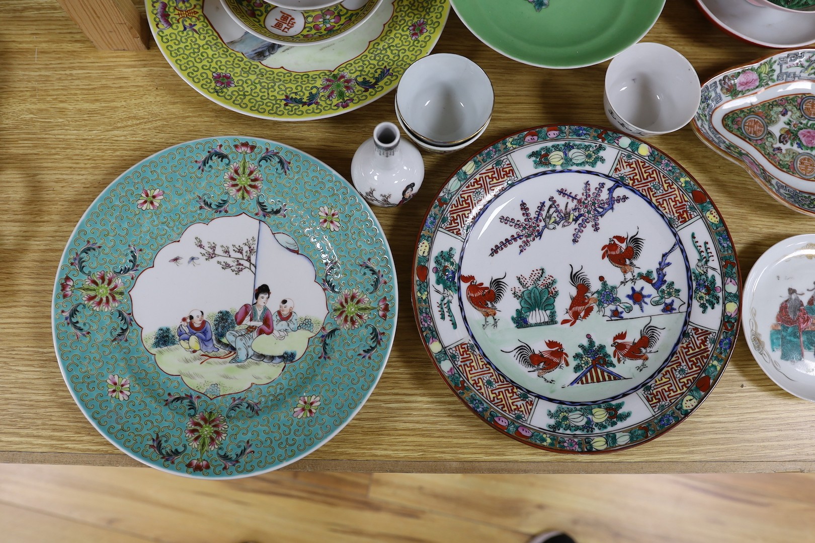 A group of Chinese enamelled porcelain plates, dishes, covers, cups and a vase